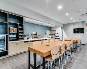 Dining area and workspace at Home2 Suites By Hilton Dallas Medical District Lovefield.