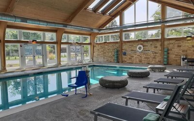 Pool loungers and indoor pool at Crowne Plaza Chicago SW.