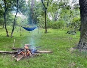Courtyard with fireplace and lounge area at SKYLARANNA Resort & Spa.
