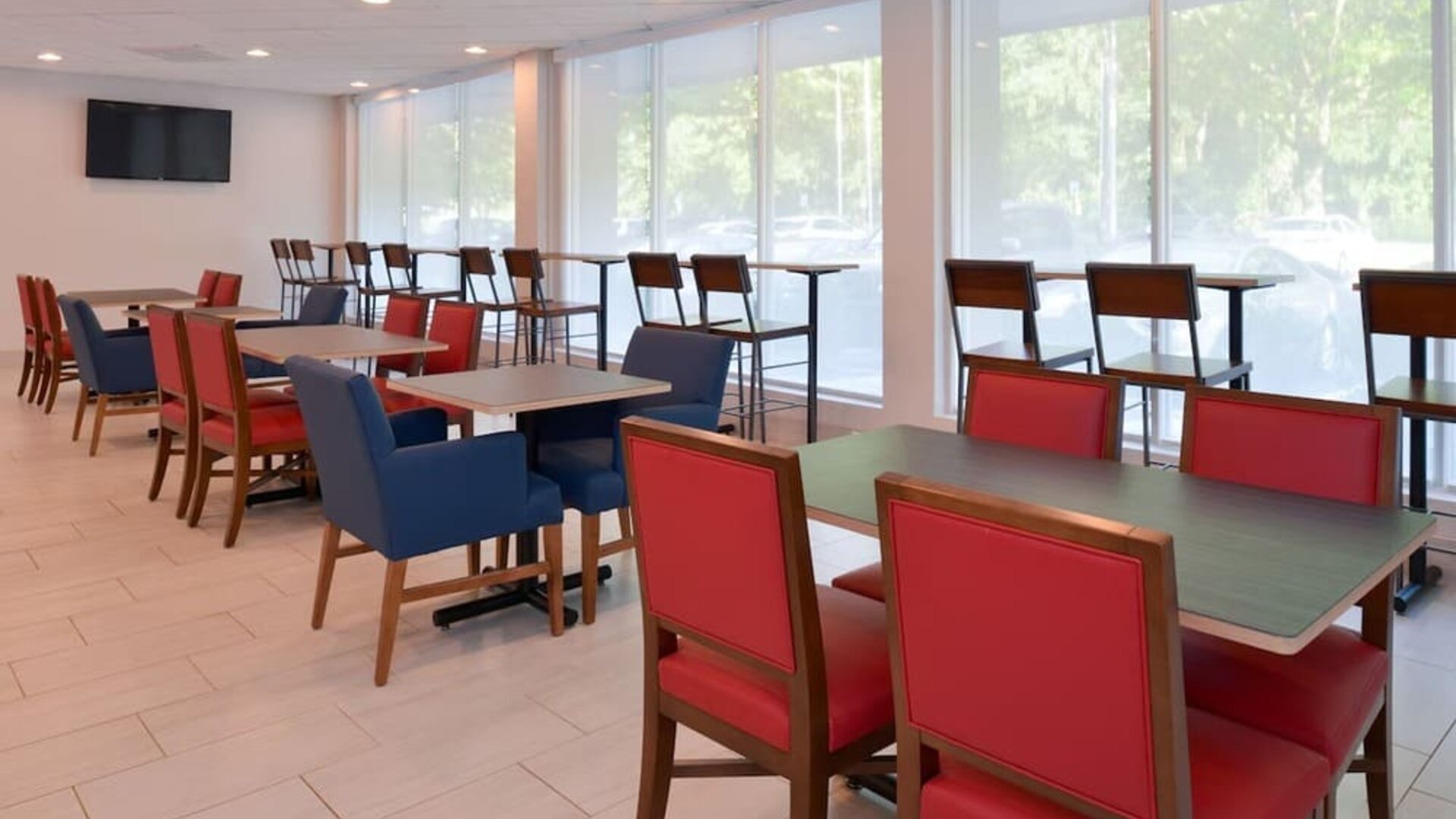 Dining area with comfortable seating at Holiday Inn Express Towson Baltimore North.
