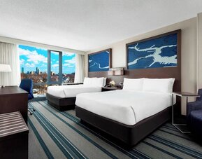 Day use twin room with work desk and living area at Courtyard Boston Cambridge.