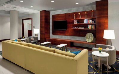 Lobby lounge with comfortable seating, perfect for coworking at Courtyard Boston Cambridge.