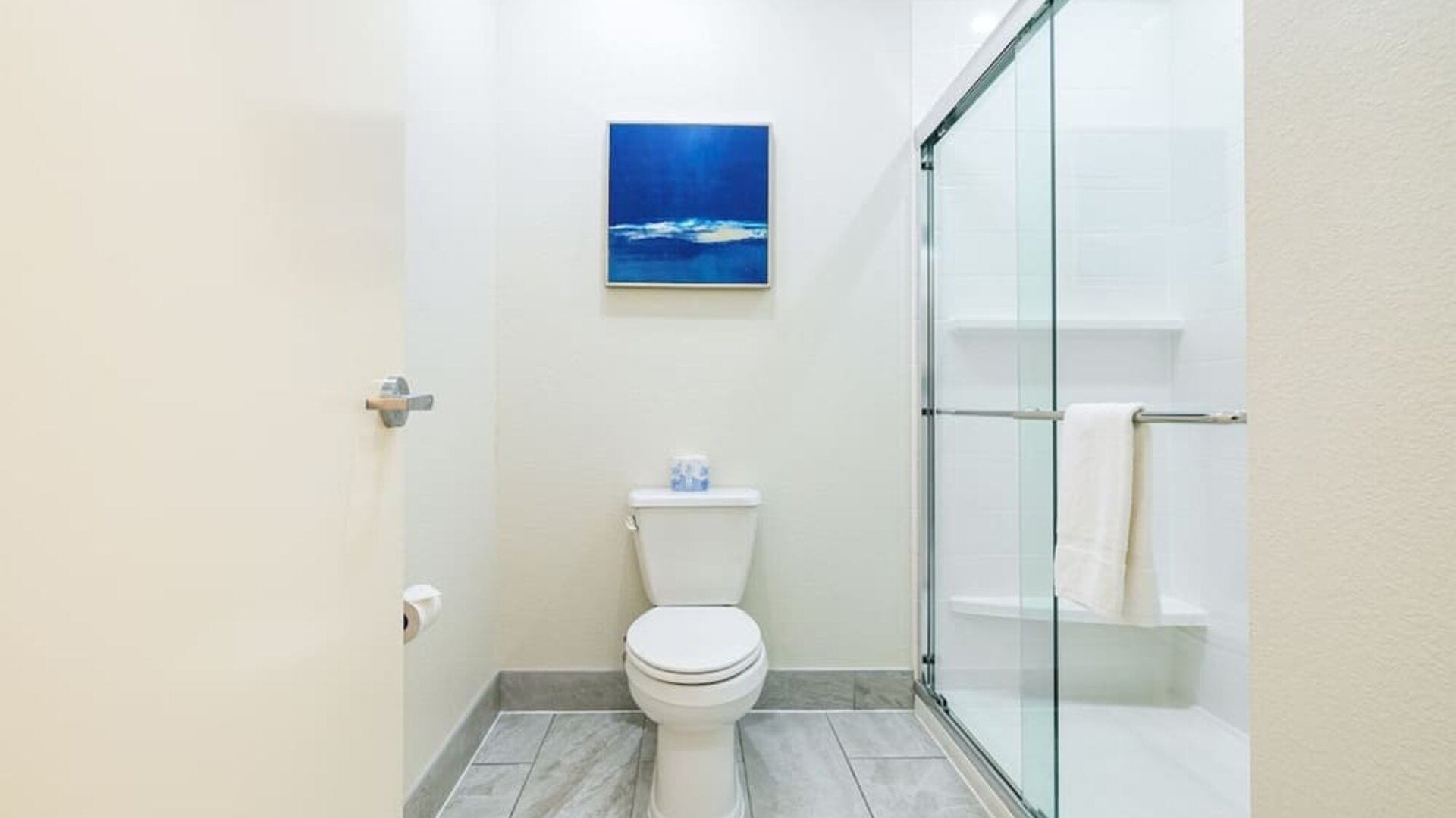 Private guest bathroom with shower and free toiletries at Palace Inn Blue IAH East.