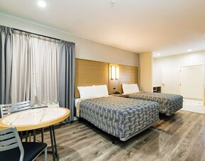 Day use twin room with workspace at Palace Inn Blue IAH East.