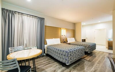 Day use twin room with workspace at Palace Inn Blue IAH East.