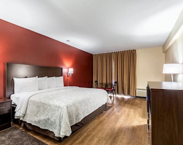 King room with workspace at Red Roof PLUS+ & Suites Houston - IAH Airport SW.