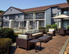 Hotel patio with lounge seating at Sonesta Select Atlanta Norcross I-85.
