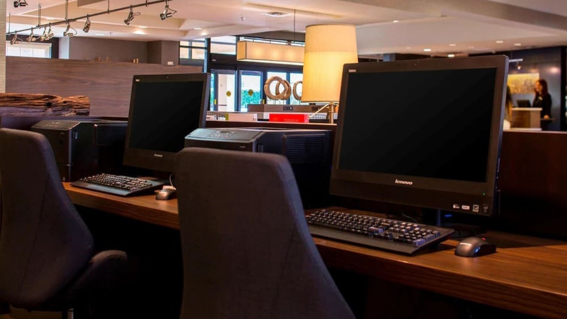 Business center with computers, printer and ergonomic chairs at Sonesta Select Atlanta Norcross I-85.