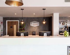 Reception desk at Hampton By Hilton Humberside Airport.