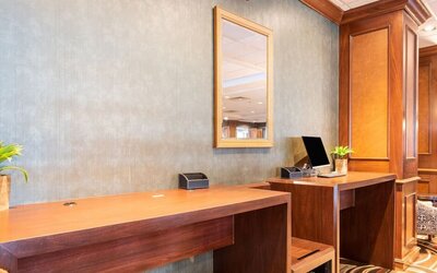 Lobby workspace with computer and printer at Wyndham Omaha. 