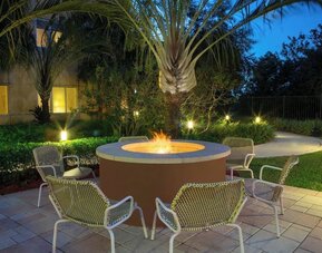 Outdoor lounge seating and fire pit at Element Miami International Airport.