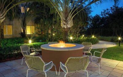 Outdoor lounge seating and fire pit at Element Miami International Airport.