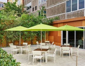 Hotel patio with seating at Element Miami International Airport.