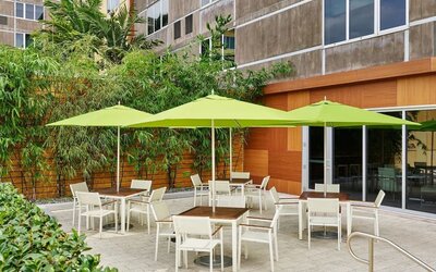 Hotel patio with seating at Element Miami International Airport.