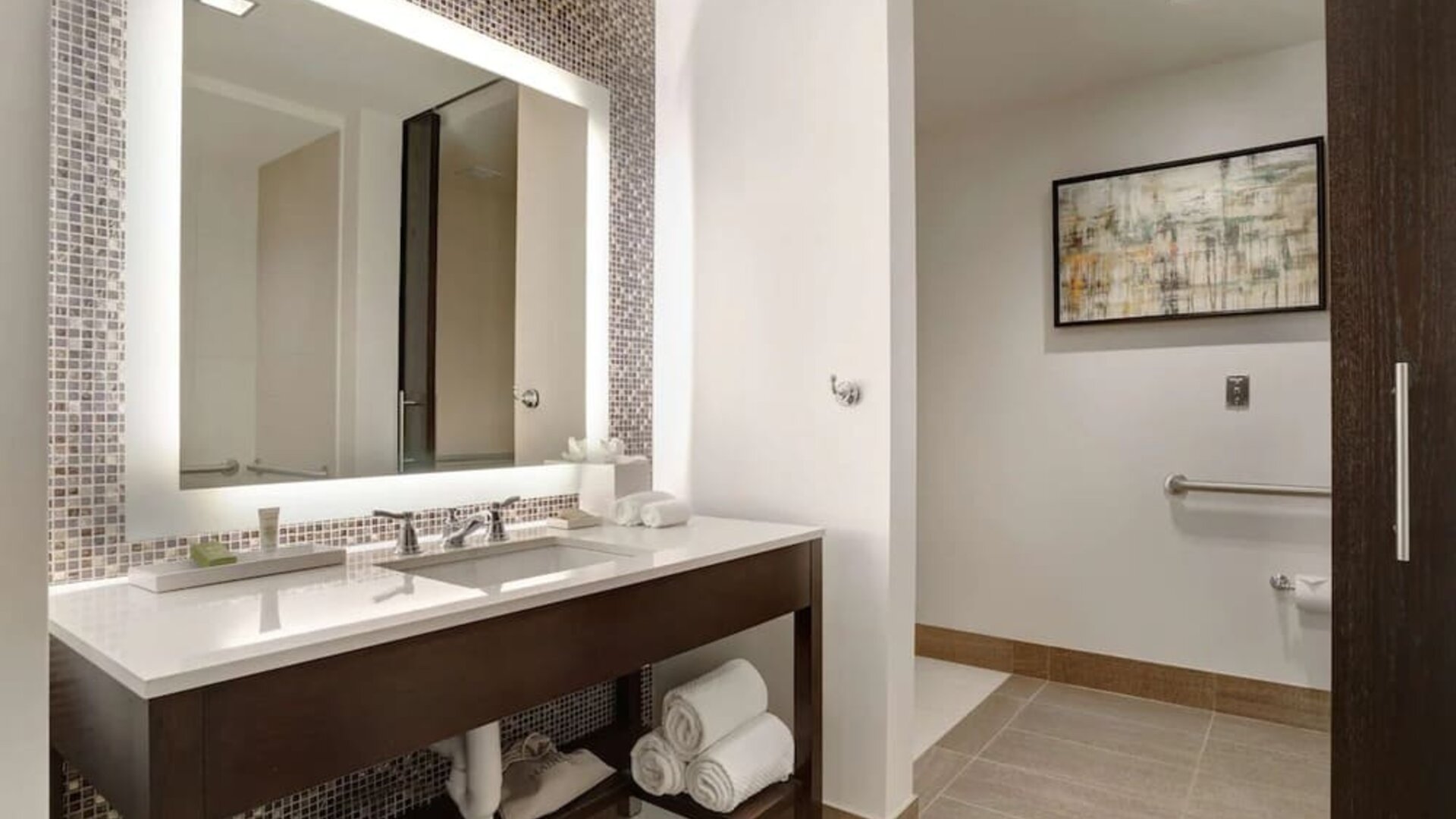 Private guest bathroom with free toiletries at Hilton Dallas/ Plano Granite Park.