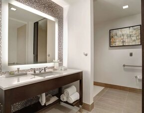 Private guest bathroom with free toiletries at Hilton Dallas/ Plano Granite Park.