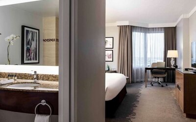 Day use room with work desk and private bathroom at Pullman Miami Airport.