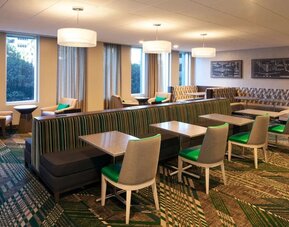 Dining area perfect for coworking at Homewood Suites By Hilton LAX Airport.