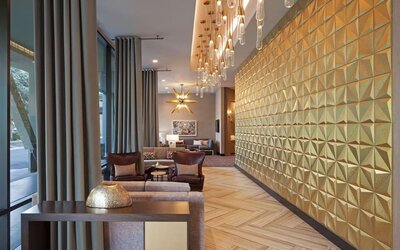 Lobby and coworking lounge at Homewood Suites By Hilton LAX Airport.