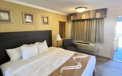 Comfortable king room at Hibiscus Inn & Suites.