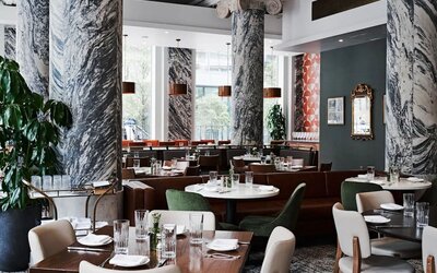 Dining area with natural light perfect for coworking at The Candler Hotel Atlanta, Curio Collection By Hilton.