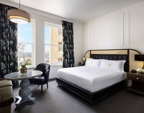 Delux king room with natural light at The Candler Hotel Atlanta, Curio Collection By Hilton.