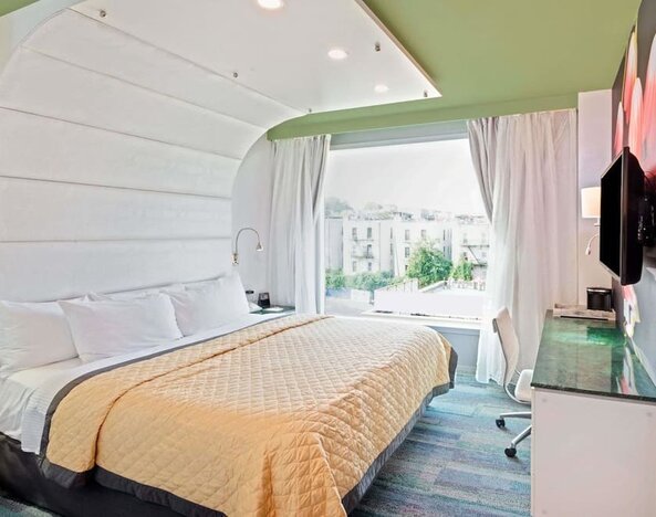 King room with comfortable bed and work desk at Wyndham Garden Brooklyn Sunset Park.
