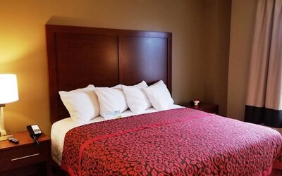 King bed at Days Inn By Wyndham Brooklyn Marine Park.