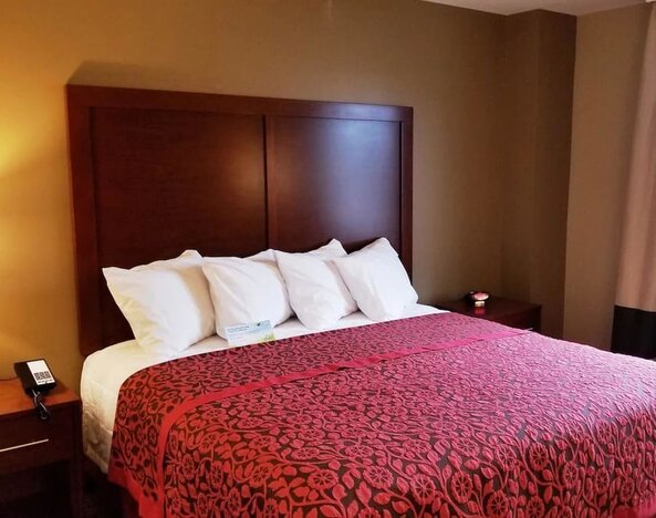 King bed at Days Inn By Wyndham Brooklyn Marine Park.