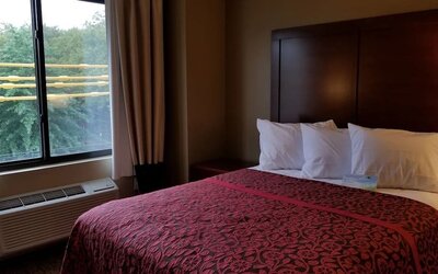 Day use room with large window and private bathroom at Days Inn By Wyndham Brooklyn Marine Park.