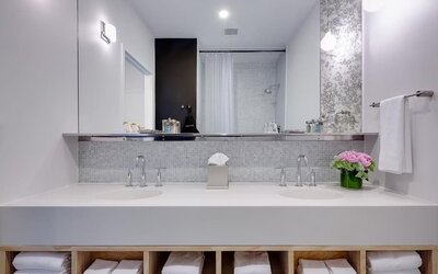Private guest bathroom with shower and free toiletries at Nu Hotel - Brooklyn.