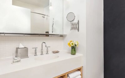 Private guest bathroom with shower and free toiletries at Nu Hotel - Brooklyn.