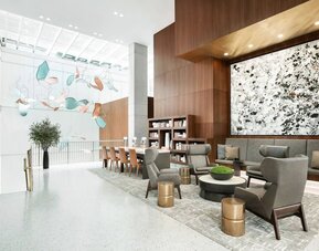 Lobby workspace and lounge area at AC Hotel New York Times Square.