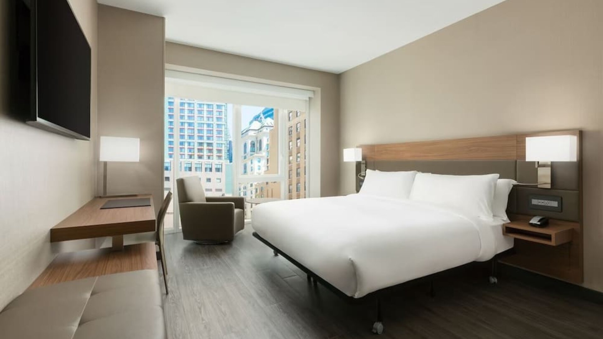 Day use room with workspace, large windows and private bathroom at AC Hotel New York Times Square.