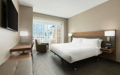 Day use room with workspace, large windows and private bathroom at AC Hotel New York Times Square.