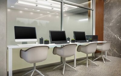 Business center with cmputers, printer and ergonomic chairs at AC Hotel New York Times Square.