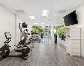 Fitness center with natural light at The Anaheim Hotel.