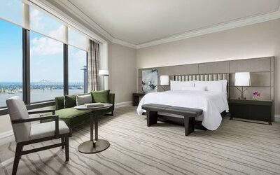 Comfortable king bedroom and a view of the river at The Westin New Orleans.
