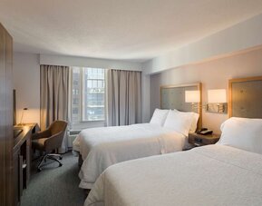 Day use twin room with work desk, large windows and private bathroom at Hampton Inn Manhattan Chelsea.