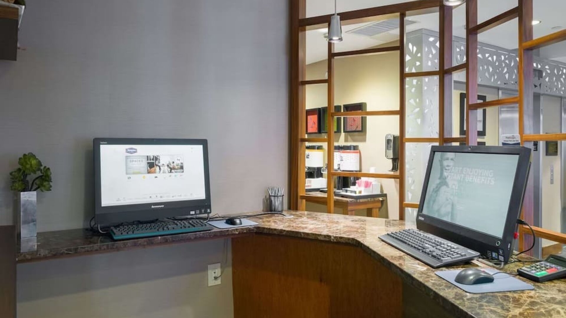 Business center with computers and printer at Hampton Inn Manhattan Chelsea.