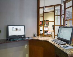 Business center with computers and printer at Hampton Inn Manhattan Chelsea.