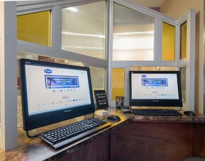 Business center with computers and printer at Hampton Inn Manhattan - Madison Square Garden.
