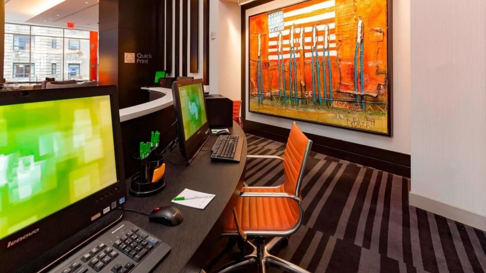 Business center with computers, printer and ergonomic chairs at Courtyard By Marriott New York Manhattan/Central Park.