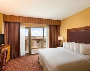 Day use room with balcony and work desk at Embassy Suites By Hilton Charlotte-Concord-Golf Resort & Spa.