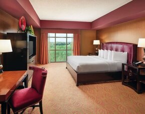 Day use room with work desk and natural light at Embassy Suites By Hilton Charlotte-Concord-Golf Resort & Spa.