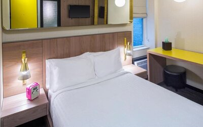 Day use room with king bed, work desk and private bathroom at Hotel Shocard NYC.