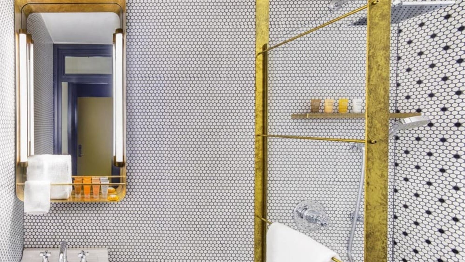 Private guest bathroom with shower and free toiletries at Hotel Shocard NYC.