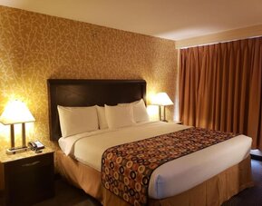 King bed at Elmhurst Hotel.