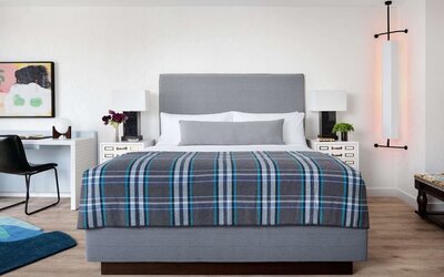 Day use room with king bed and work desk at Graduate New York.