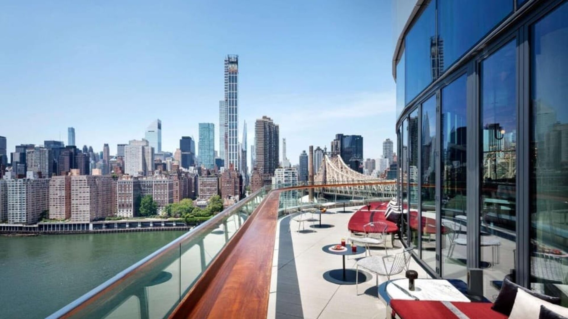 Rooftop terrace with comfortable seating and city view at Graduate New York.